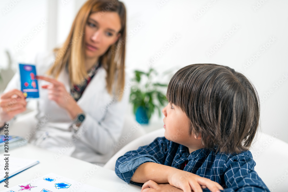 Mental Health Test for Children. Toddler Doing Logic Test with Cards Mental Health Test for Children. Toddler Doing Logic Test with Cards