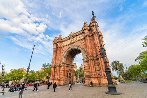 Barcelona, Spain - April, 2019: Arc de Triomf de Barcelona is a triumphal arch in the city of Barcelona in Catalonia, Spain during a cloudy day. photo