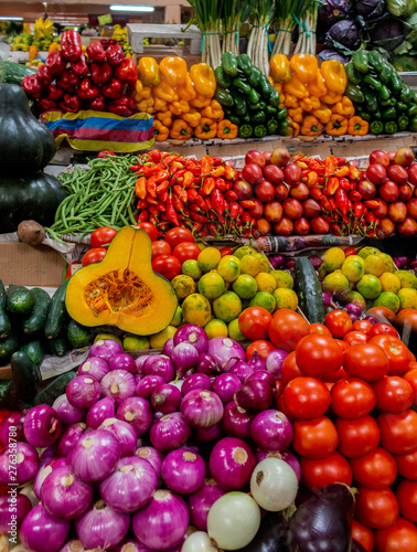 variety of colorful vegetables and legumes at a market stall