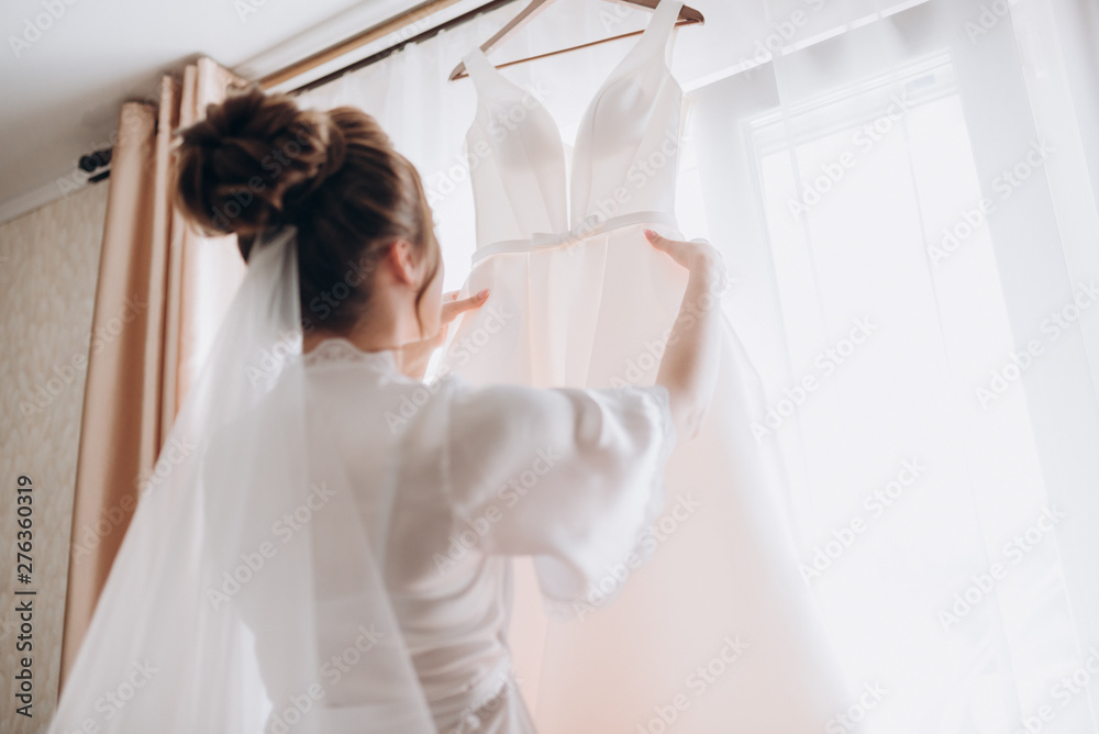 the bride is considering a wedding dress the bride is considering a wedding dress