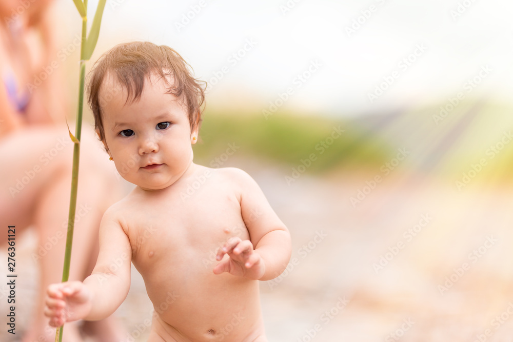 small girl without clothes on beach at sea play with sticks Stock Photo Adobe Stock