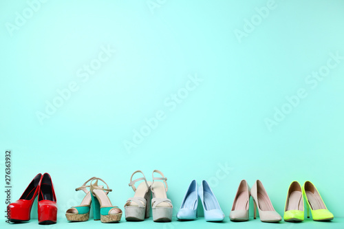 Different high heel shoes on mint background