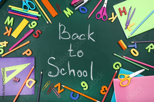 Text Back To School with stationery on green background