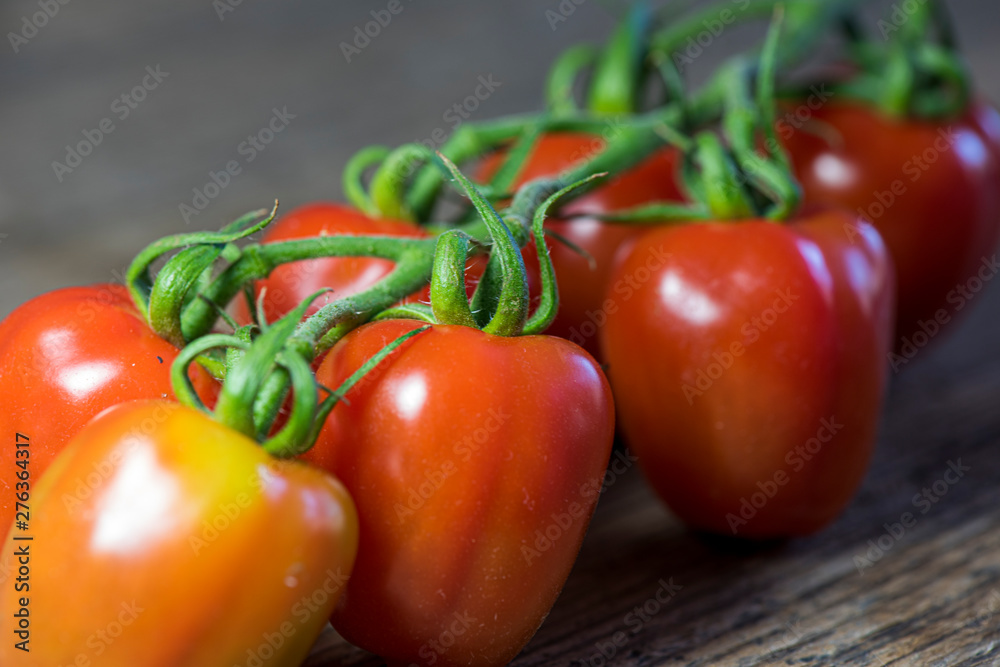Fresh tomatoes on wood background Fresh tomatoes on wood background