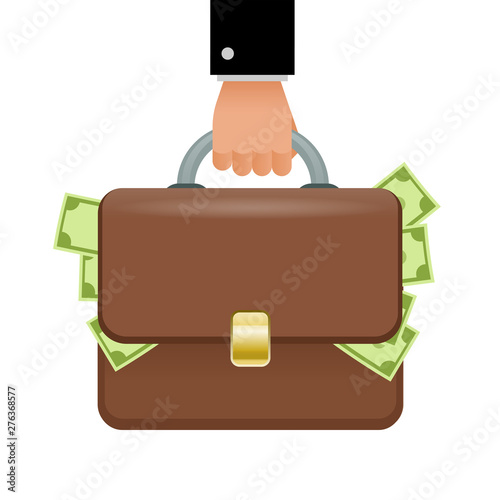 Hand holding briefcase full of money. Concept of success, earnings.