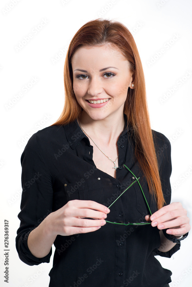 Portrait on happy smiling business lady in black suit holding glasses on grey background Portrait on happy smiling business lady in black suit holding glasses on grey background