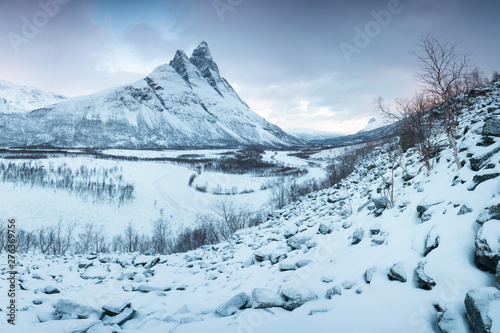 Beautiful landscape scene with Signaldalelva river and Otertinden mountain in background in Northern Norway . Sunset or sunrise in Mountains And Fjords  Winter Landscape.
