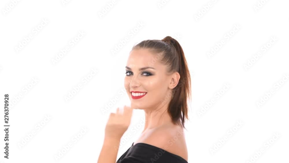 Beauty concept. A charming woman is fondling her face on a white background. Beauty concept. A charming woman is fondling her face on a white background.