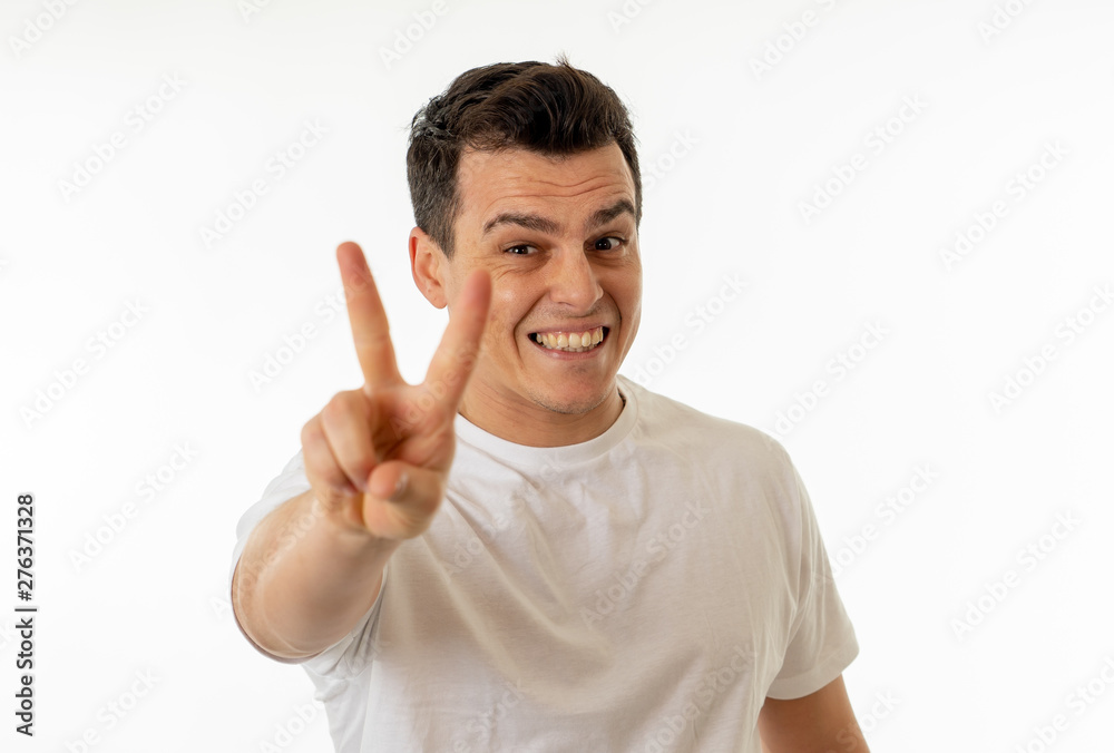 Human expressions and emotions. Young attractive man with a happy face, smiling and celebrating Human expressions and emotions. Young attractive man with a happy face, smiling and celebrating