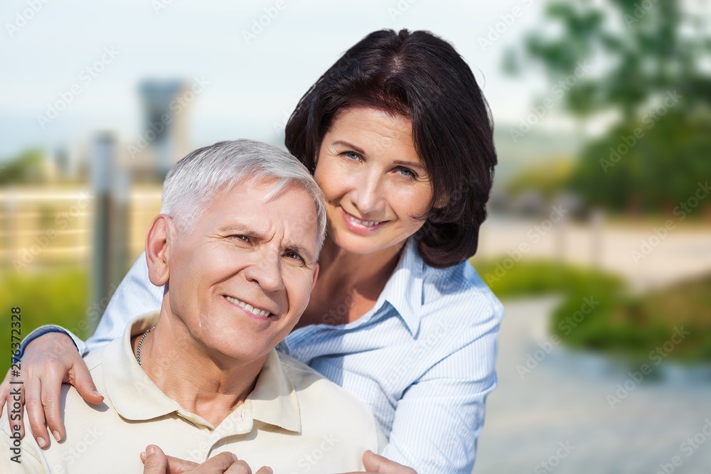 Fototapeta premium Portrait of happy senior couple smiling