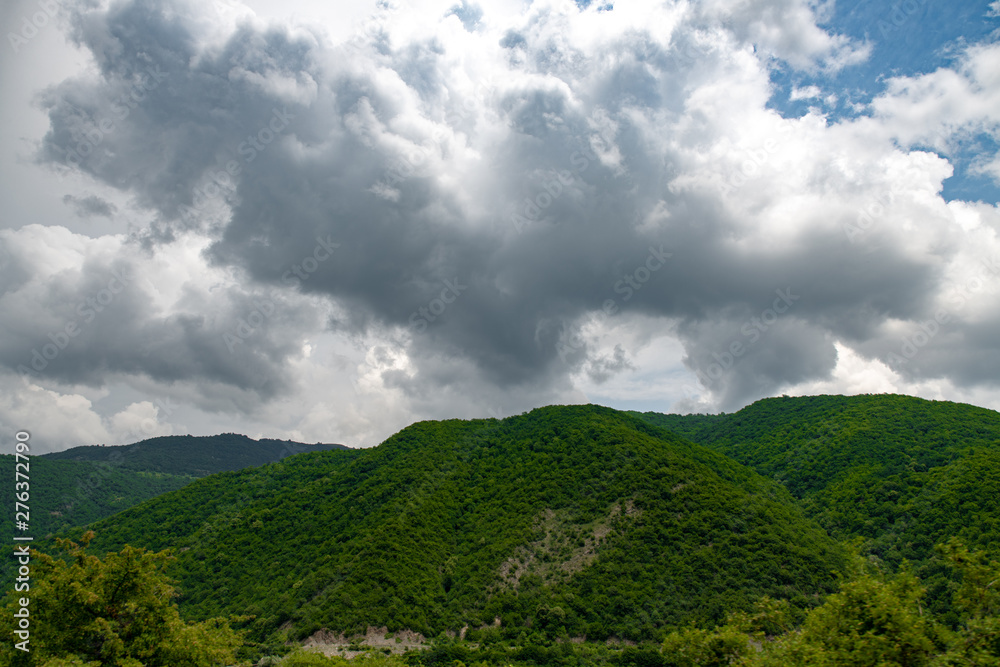 various mountain landscapes with cities and sky