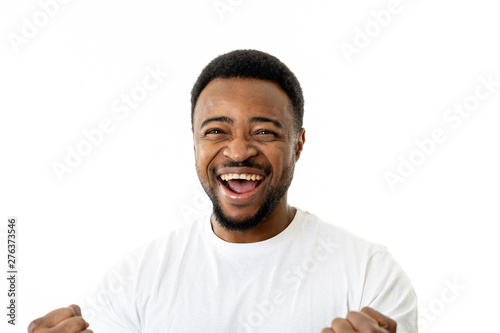 Close up portrait of surprised and happy man celebrating victory and wining team or lottery