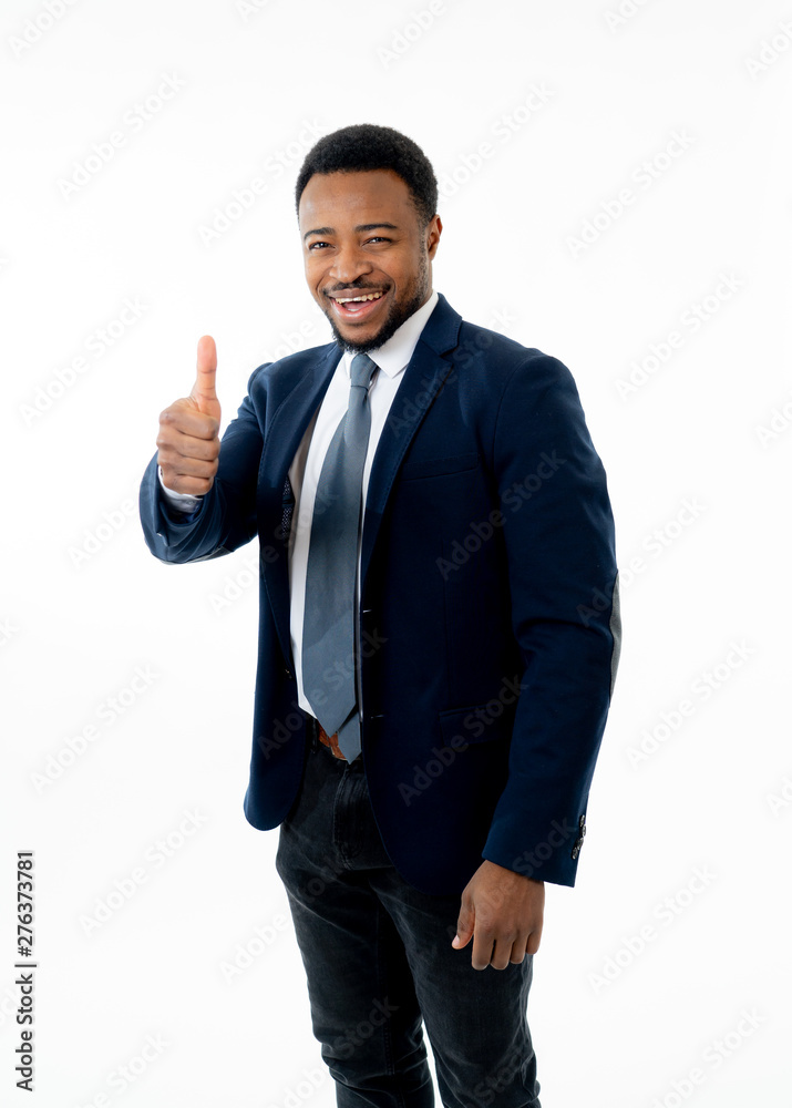 Half-length portrait of attractive stylish and successful businessman smiling with thumb up gesture Half-length portrait of attractive stylish and successful businessman smiling with thumb up gesture