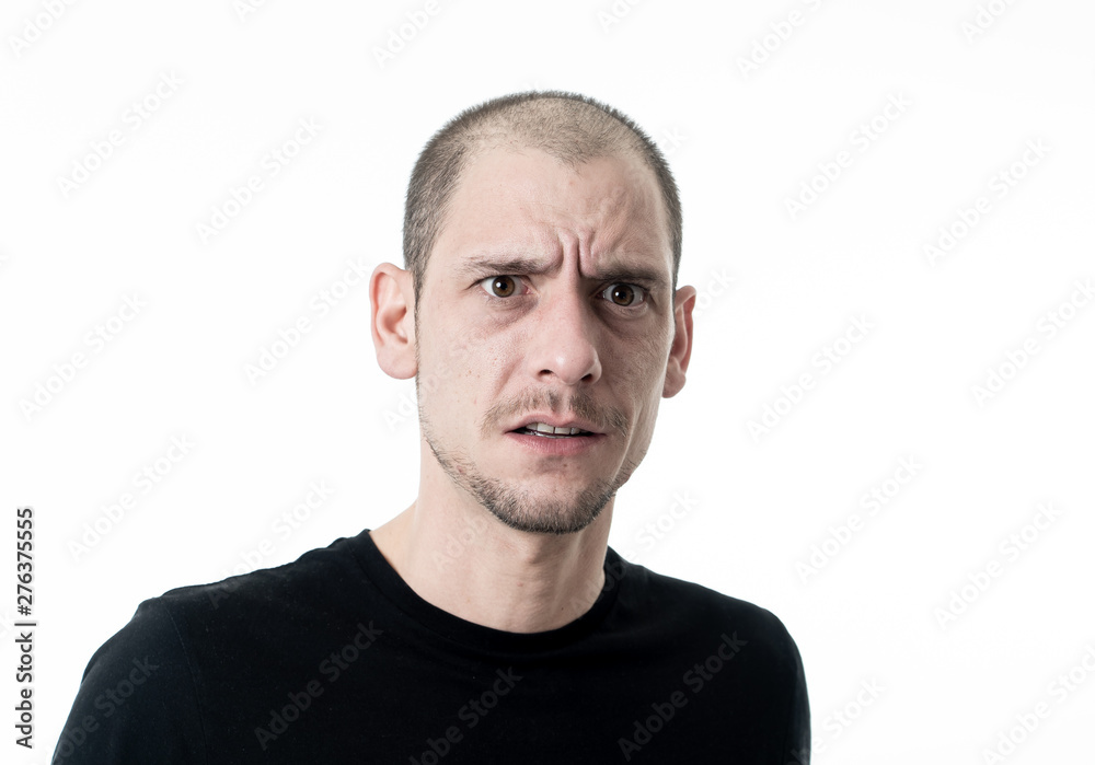 Mad and aggressive guy in facial expressions and negative human emotions Mad and aggressive guy in facial expressions and negative human emotions