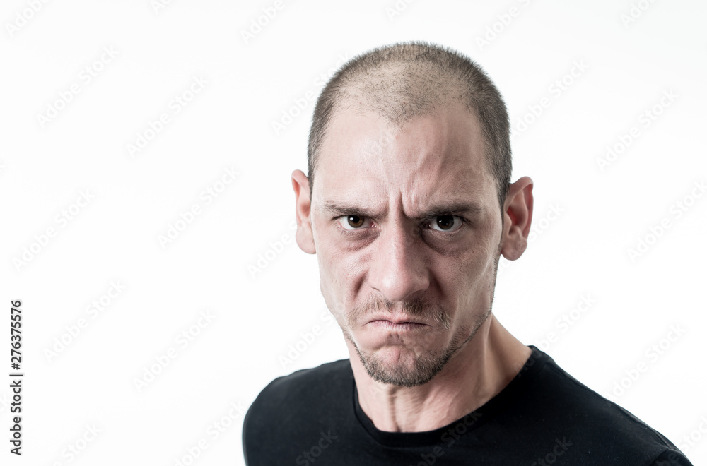 Mad and aggressive guy in facial expressions and negative human emotions Mad and aggressive guy in facial expressions and negative human emotions
