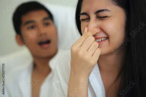 Фотография The girl must close her nose because she can not tolerate her of the husband mouth odor