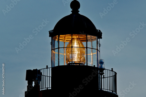 Closeup of Fresnel Lens that concentrates  light into a relatively narrow beam. Ideal for lighthouse warning system, Pacific Grove, California  photo