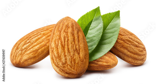 Close-up of almonds with leaves, isolated on white background