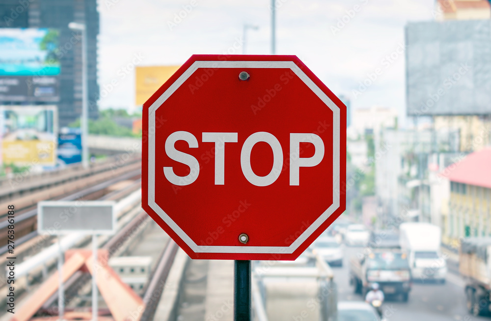 Red Octagonal Stop Sign on the Skytrain Platform.