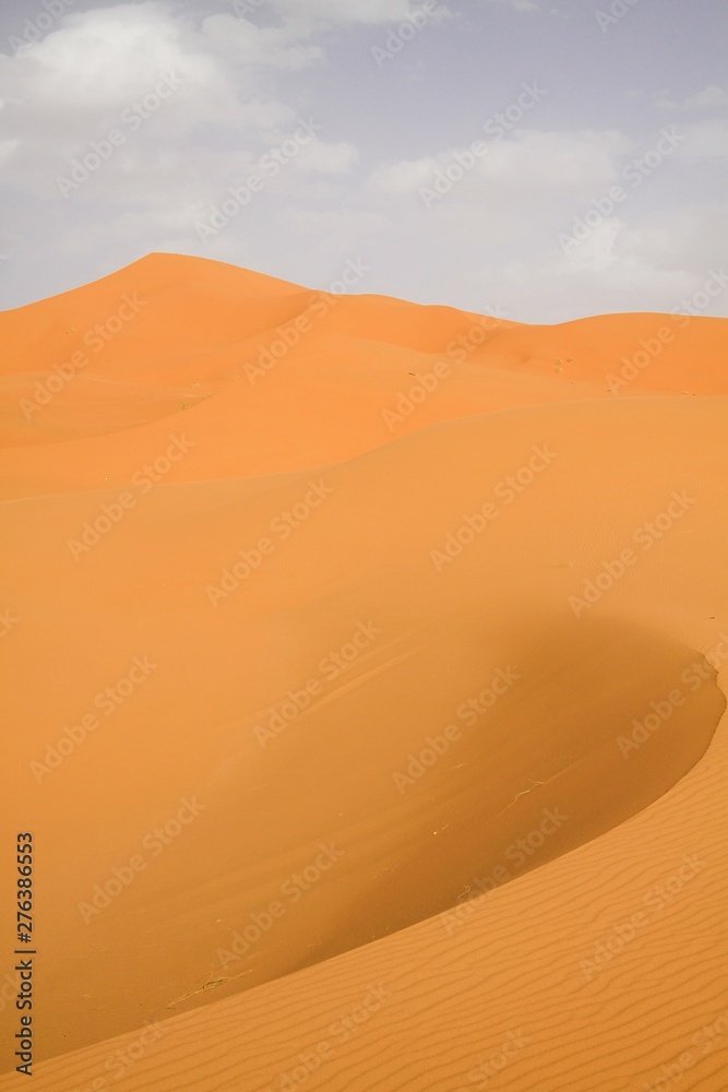 Lonely isolated sand dunes belt in the Sahara desert near Erg Chebbi, Morocco
