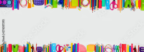 School supplies double border banner. Top view on a white background with copy space. Back to school concept. photo