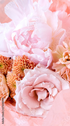 Flower shop with holiday beautiful flowers. Bouquet of flowers closeup background. 9:16. Vertical size of the picture.