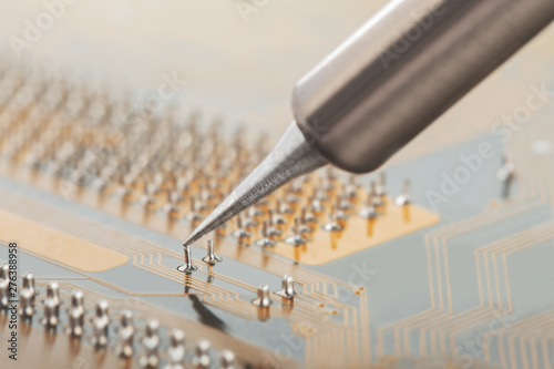 Obraz na plátně Soldering of electronic circuit board with electronic components