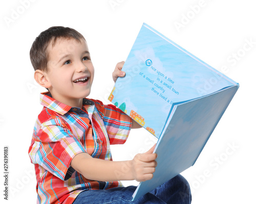 Cute little boy reading boo...