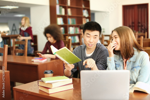 Students with laptop studyi...
