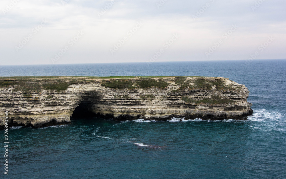 Grotto on the sea coast in the Park Atlesh in the Crimea, Tarkhankut Grotto on the sea coast in the Park Atlesh in the Crimea, Tarkhankut