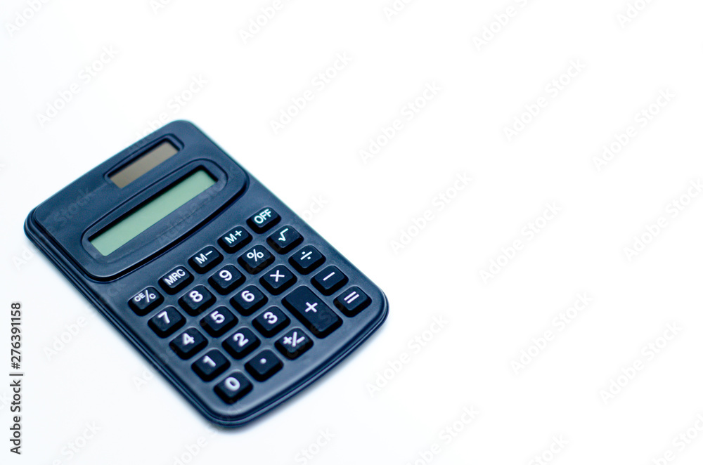 Black calculator placed isolated on a white background.Copy space. Black calculator placed isolated on a white background.Copy space.