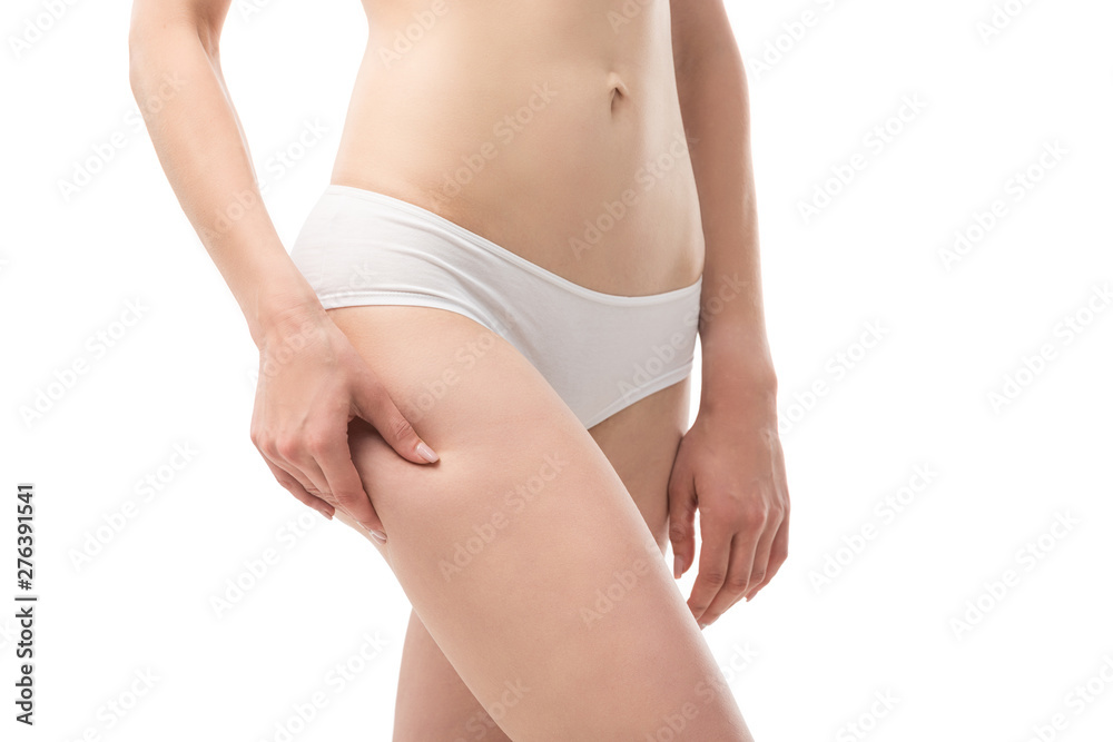 cropped view of young woman in panties touching hip isolated on white