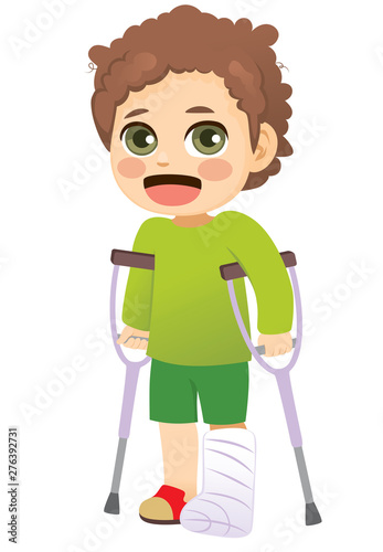 Young little boy with plaster leg cast walking with crutches