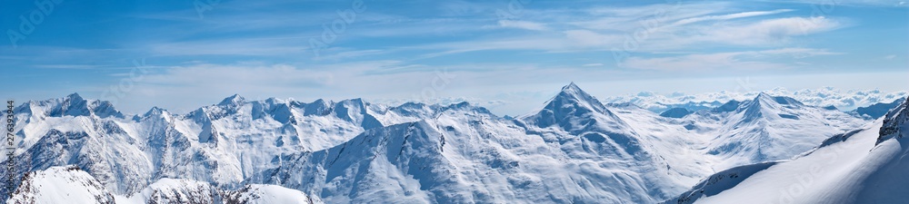 Winter mountains panorama view with the high peaks covered by the snow near Saas-Fee in Switzerland.