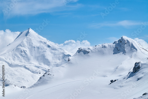 Winter mountains view with the high peaks covered by the snow near Saas-Fee in Switzerland. © thecolorpixels