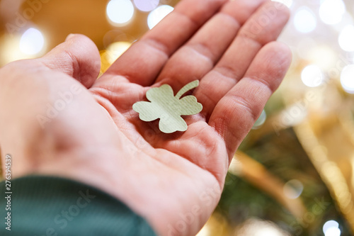  leaf of clover shape cut from paper in the hand