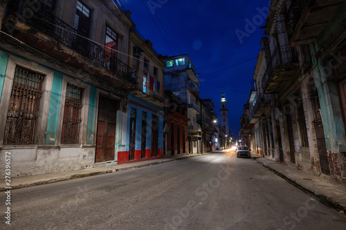 Street view of the residential neighborhood in the Old Havana City, Capital of Cuba, during night time after sunset. © edb3_16
