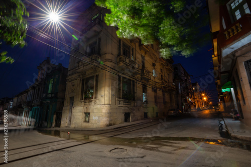 Street view of the residential neighborhood in the Old Havana City, Capital of Cuba, during night time after sunset. © edb3_16