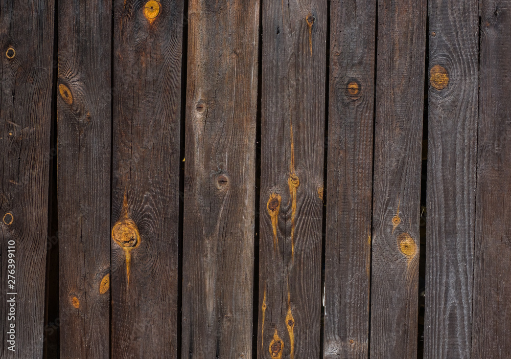 An aging wall made of wooden planks. An aging wall made of wooden planks.