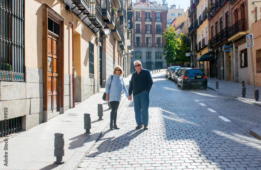 Happy senior couple traveling around Europe enjoying retirement lifestyle