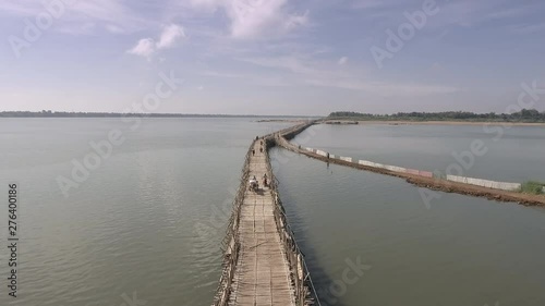 Wallpaper Mural Drone camera tilting back down on an horse cart and motorbike crossing a bamboo bridge over a river Torontodigital.ca