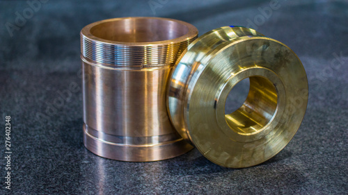 Bronze billet for cutting teeth and threaded sleeve.