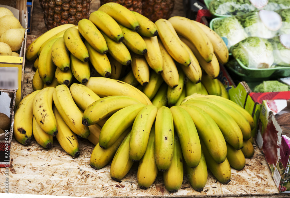 Bananas in street vendor stall with other fruits