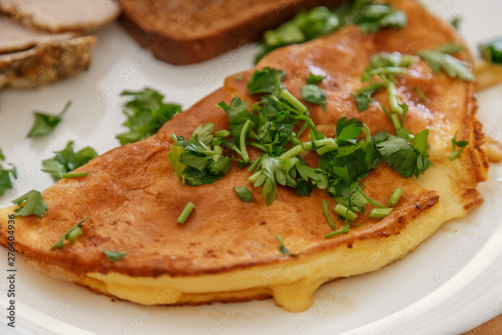 Breakfast, scrambled eggs on a plate with bacon, parsley and cheese. Breakfast, scrambled eggs on a plate with bacon, parsley and cheese.