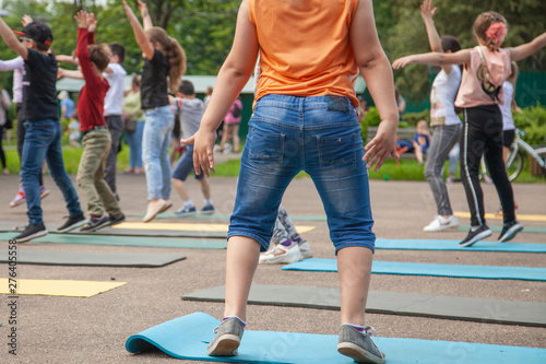 Children do exercises on the street. Children's fitness. Exercises for children to develop the body. Children's holiday. Zdorove baby activity. photo