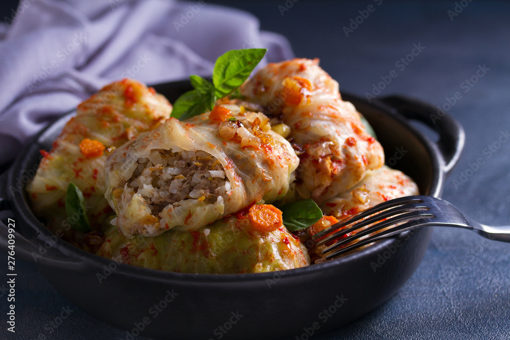 Stuffed cabbage leaves with meat, rice and vegetables. Chou farci, dolma, sarma, sarmale, golubtsy or golabki - popular dish in many countries Stuffed cabbage leaves with meat, rice and vegetables. Chou farci, dolma, sarma, sarmale, golubtsy or golabki - popular dish in many countries