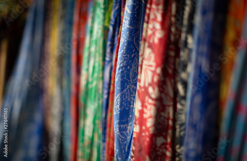Scarves for sale at the market. Colorful fabrics 