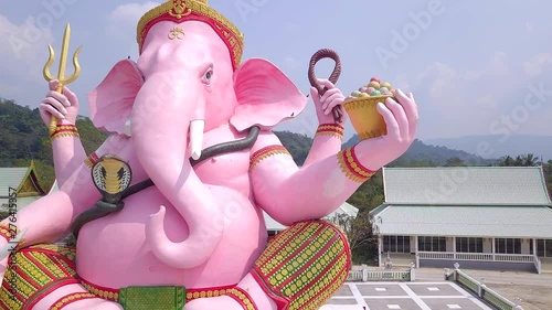 Pink Statue of Ganesha the Elephant Hindu Deity in Nakhon Nayok Thailand photo