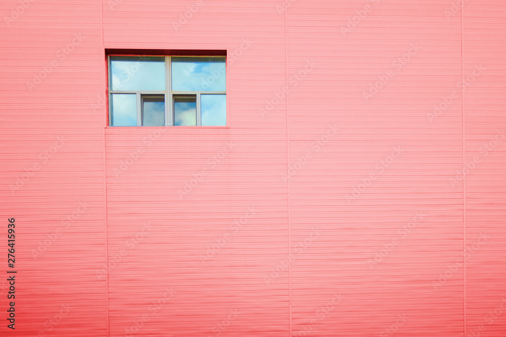 Red facade wall with one window with reflection of sky and clouds. Copy space structure lines pattern. Industrial urban architecture look Red facade wall with one window with reflection of sky and clouds. Copy space structure lines pattern. Industrial urban architecture look