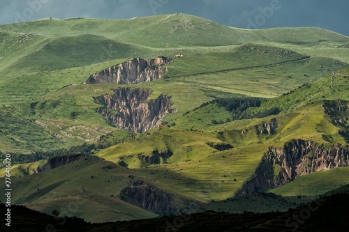 Stunning landscape near Goris city in Armenia. Green mountains and rocky cliffs in the sun after a storm.